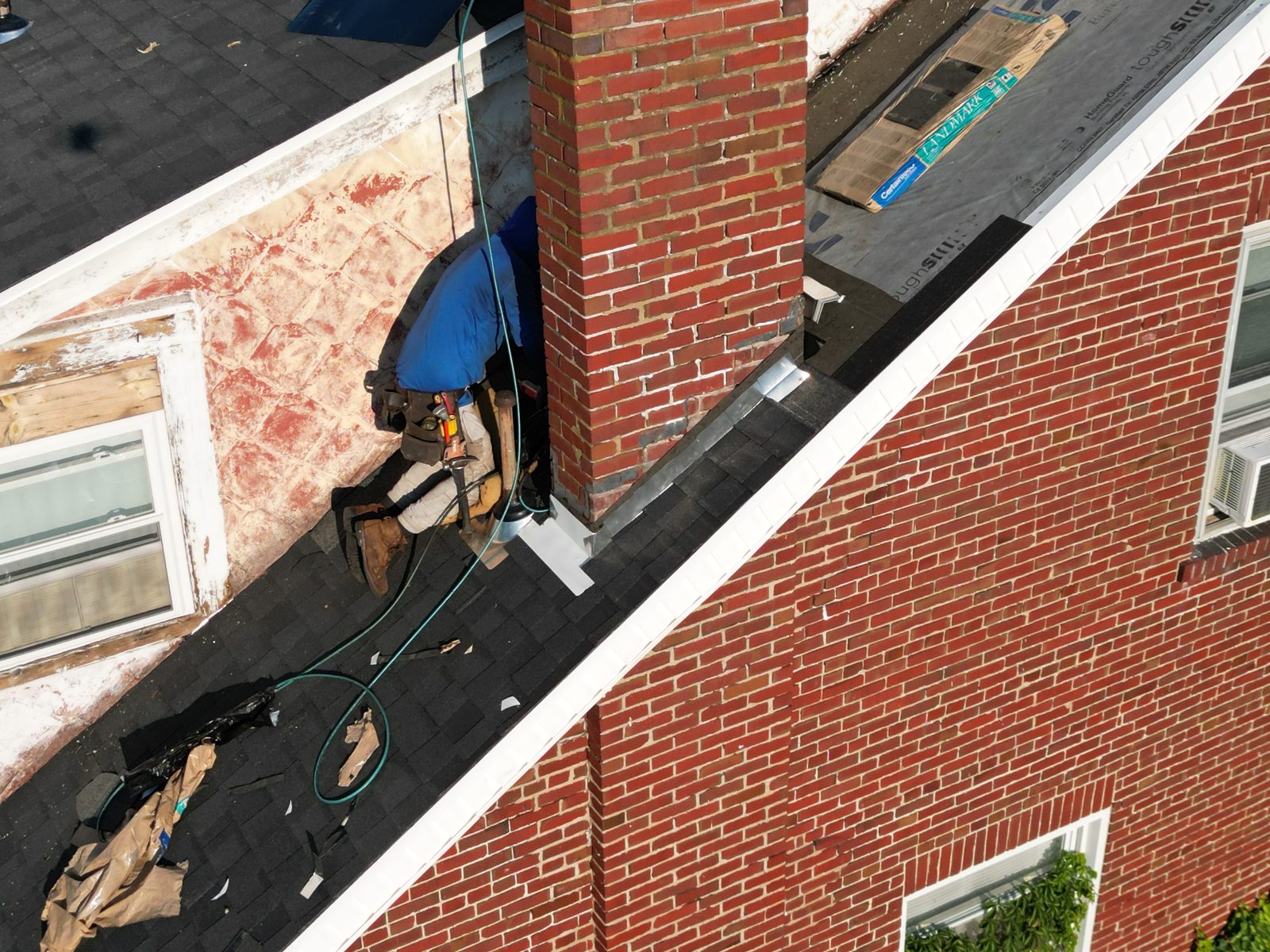 Roofer installing the roof edge on a brick home in Shillington, PA