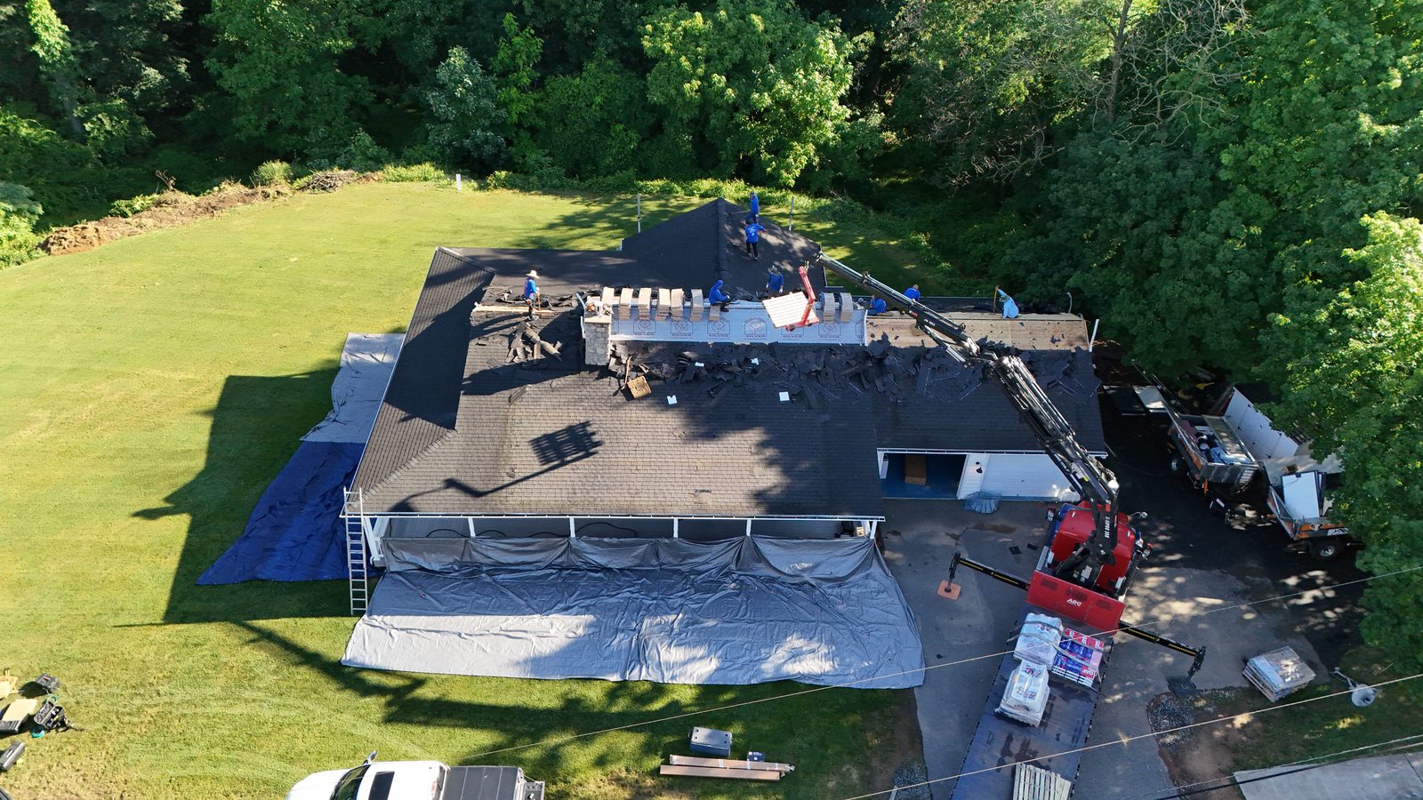 Aerial view of a roofing crew during tear-off on a Mohnton, PA home