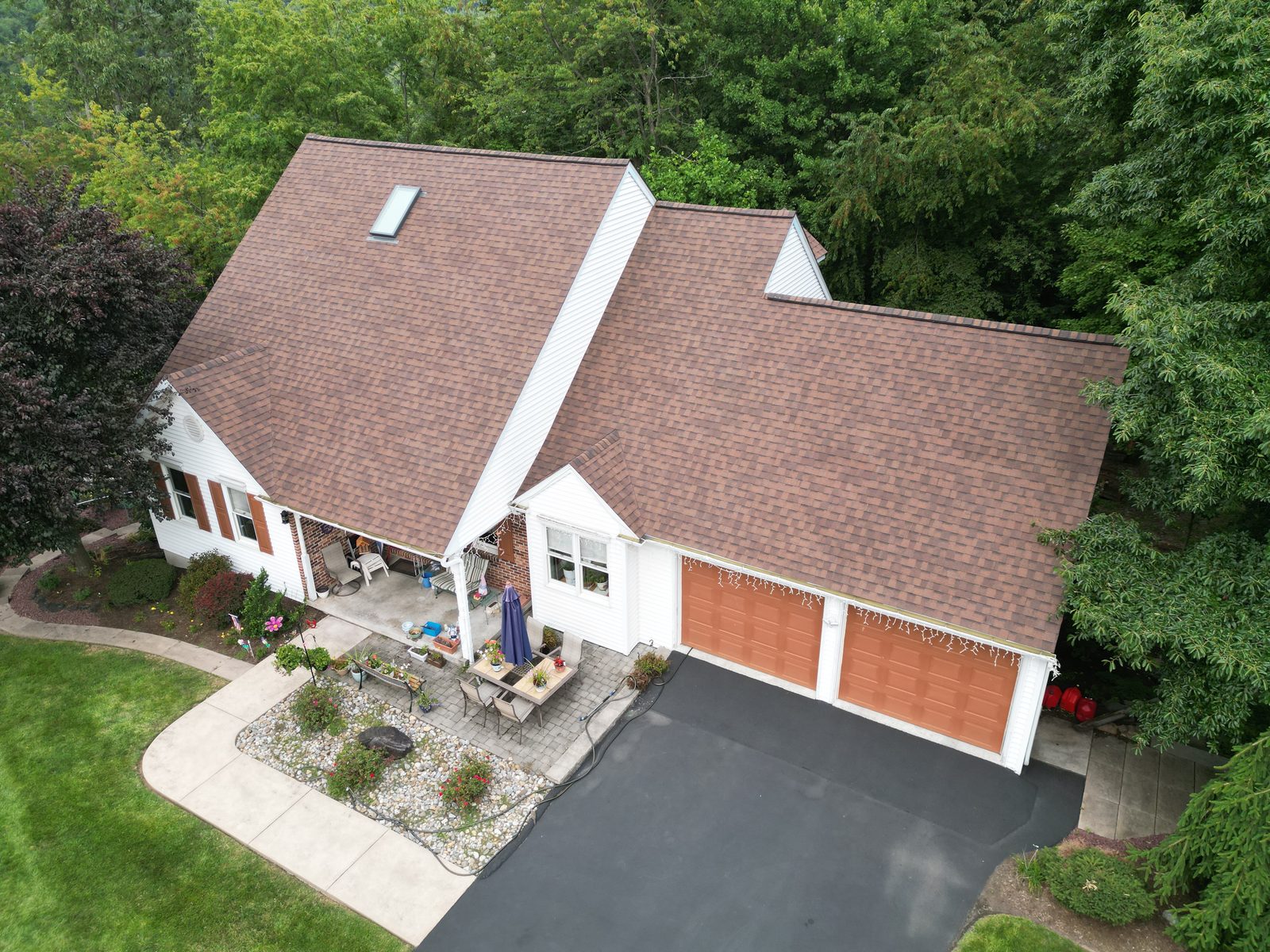 Drone view of a completed roof replacement on a brick home in Mohnton, PA