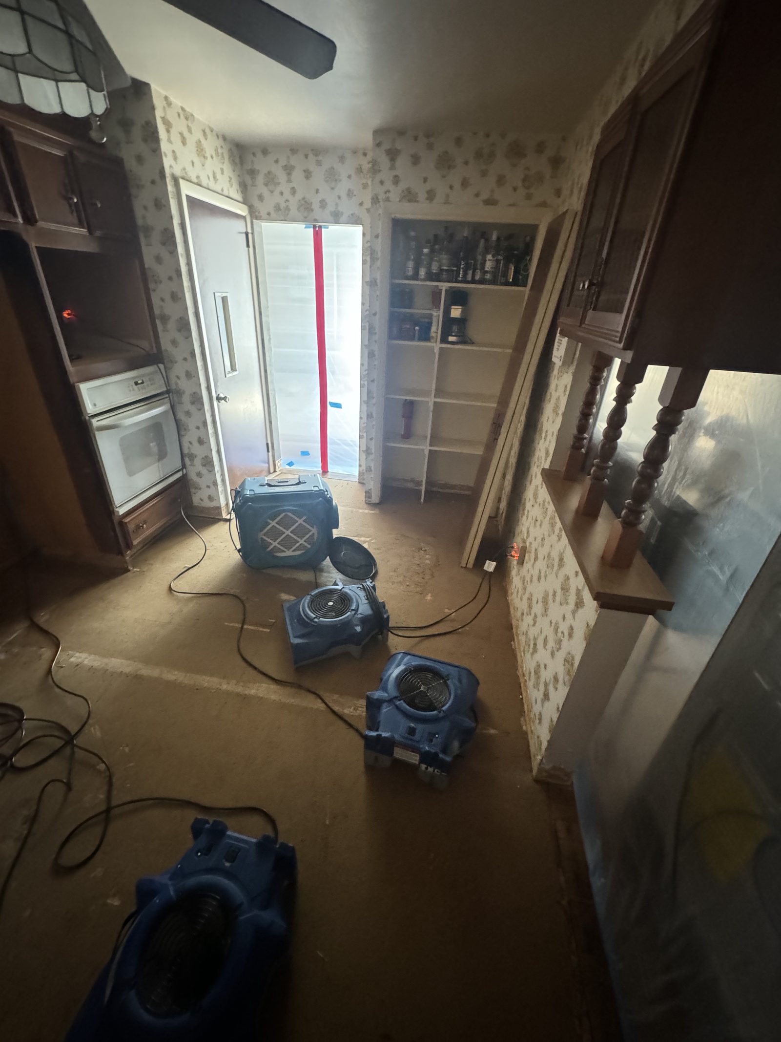 Air movers drying a water-damaged kitchen in Reading, PA