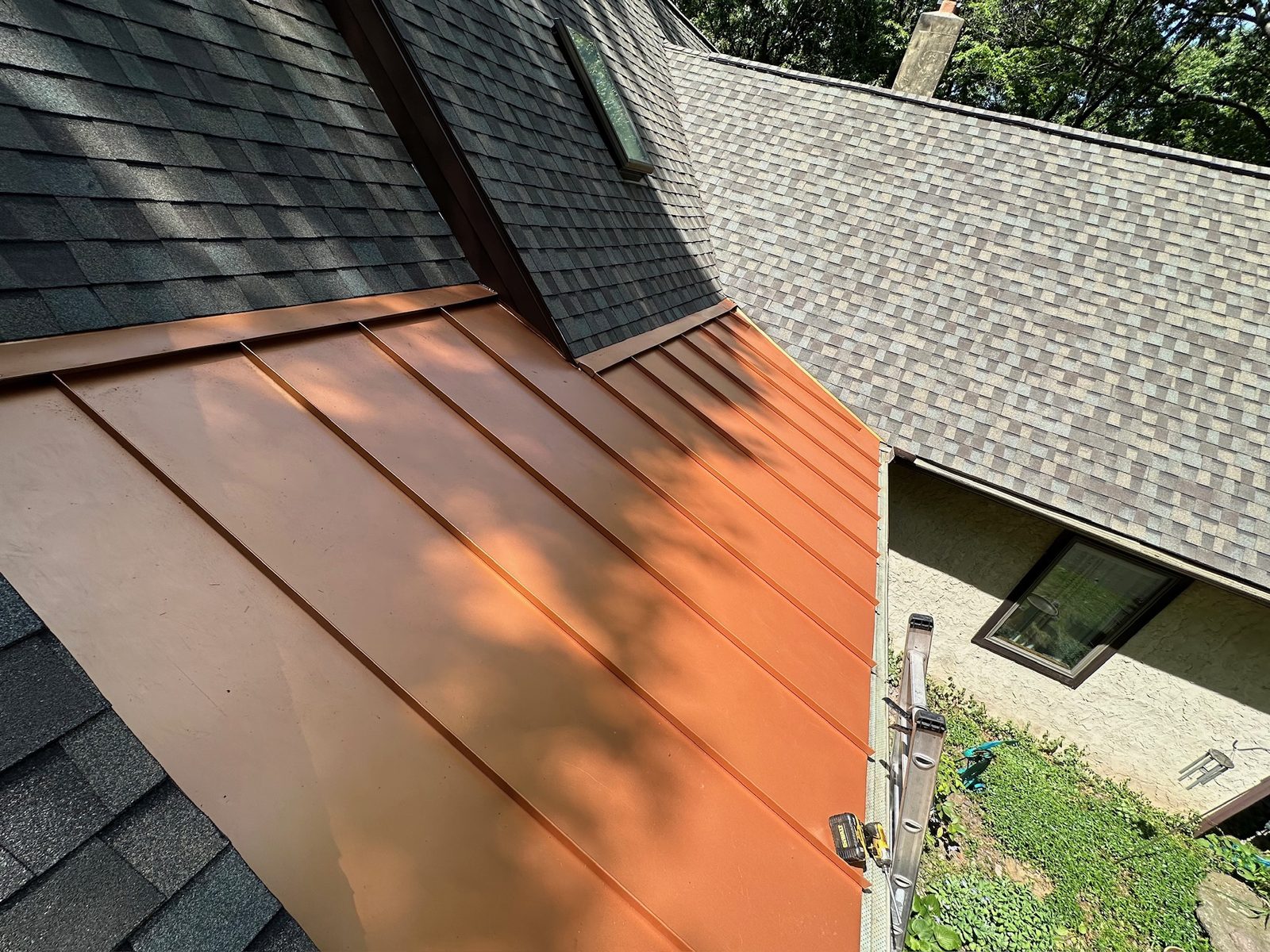 Red standing seam metal roof detail on a Mohnton, PA home