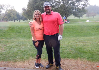 Image of two people at Golf Course