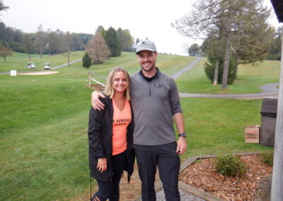 Image of two people at Golf Course