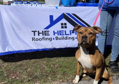 Dog in front of advertising table at event