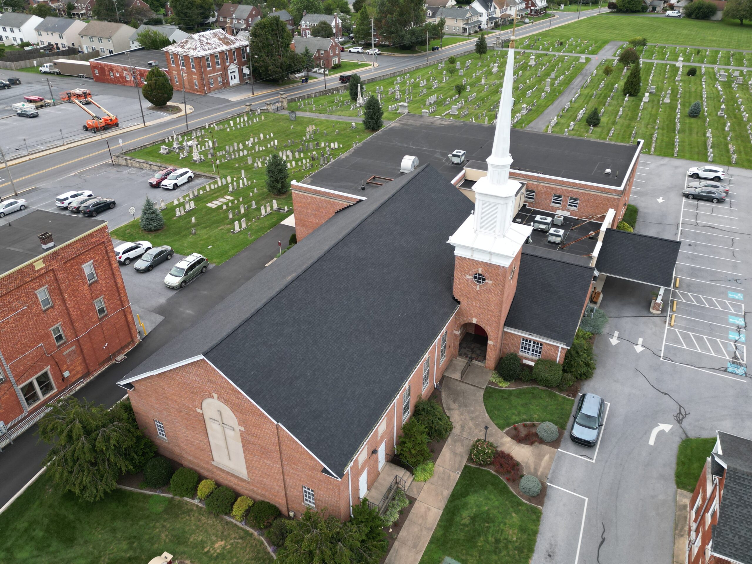 Aerial shot of church with new shingled roof