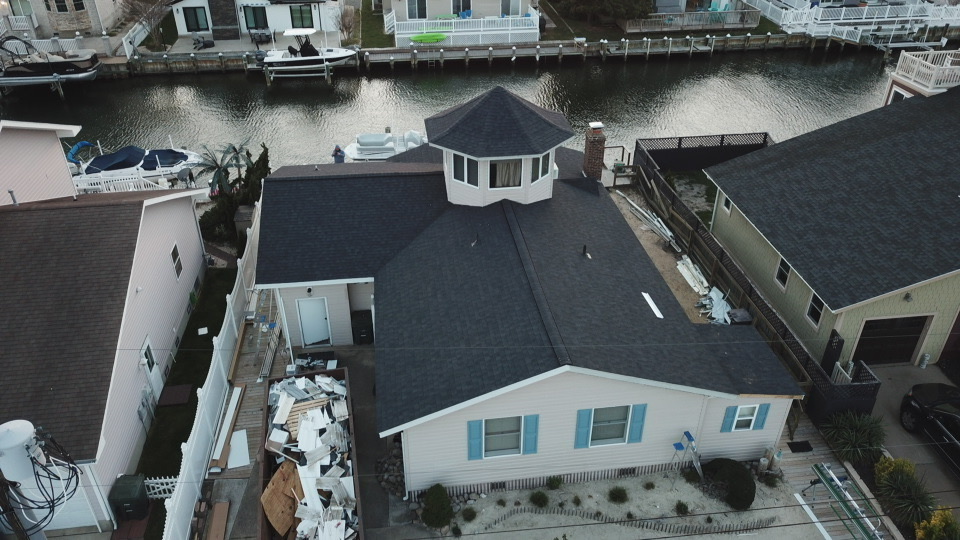 Aerial shot of waterfront home with new roof