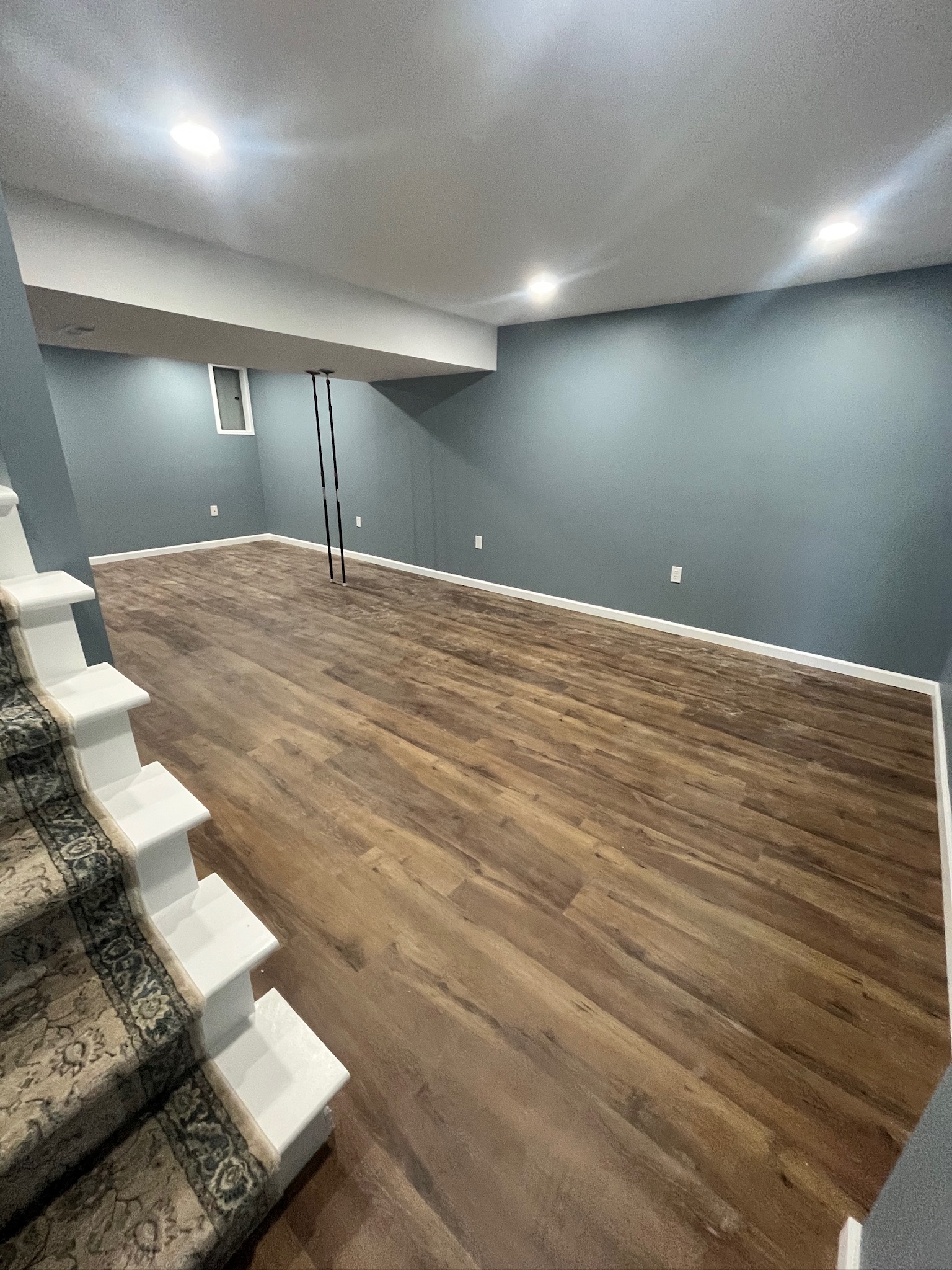 Remodeled room in home with wooden flooring