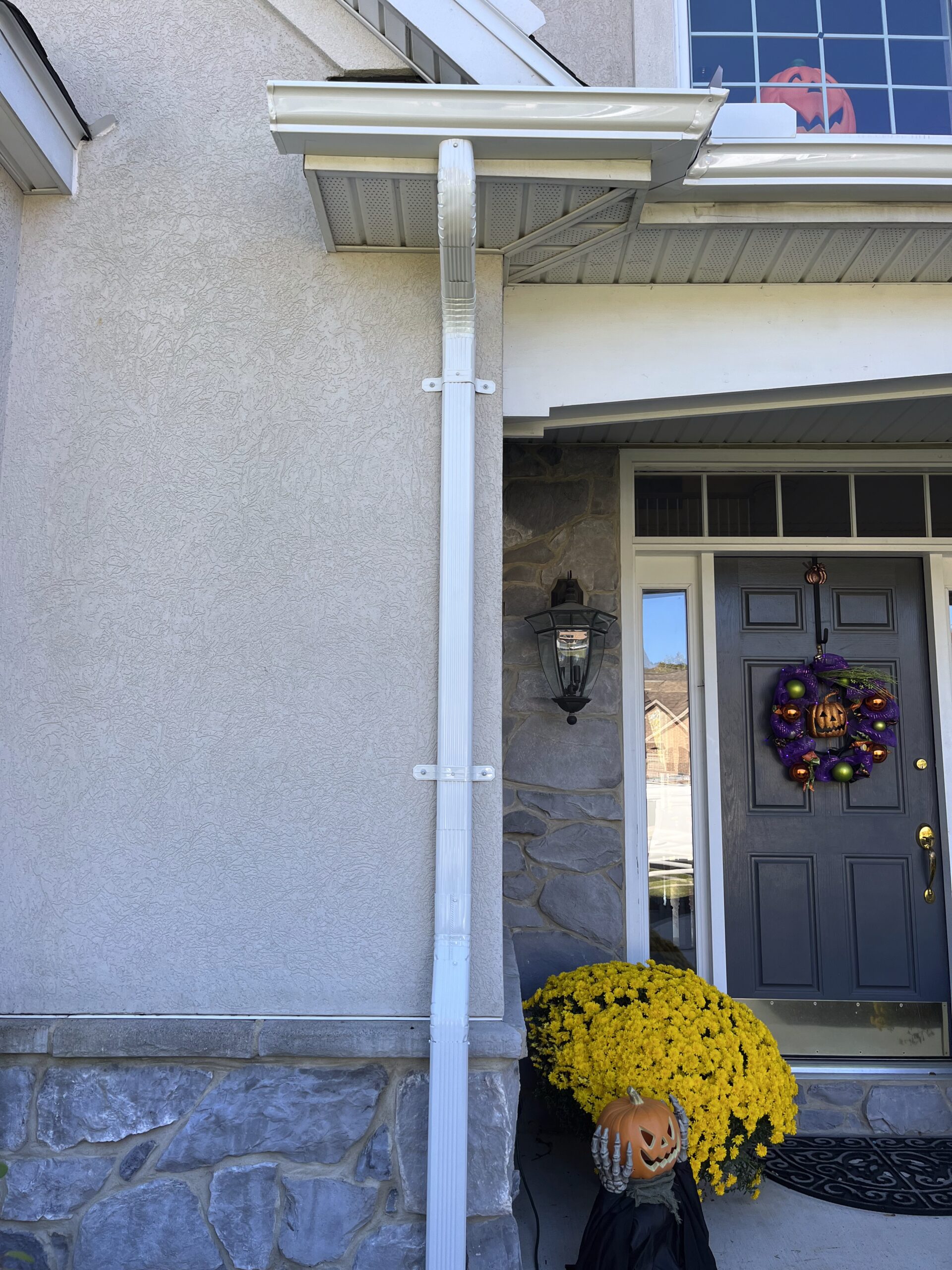 White drainage gutter on home