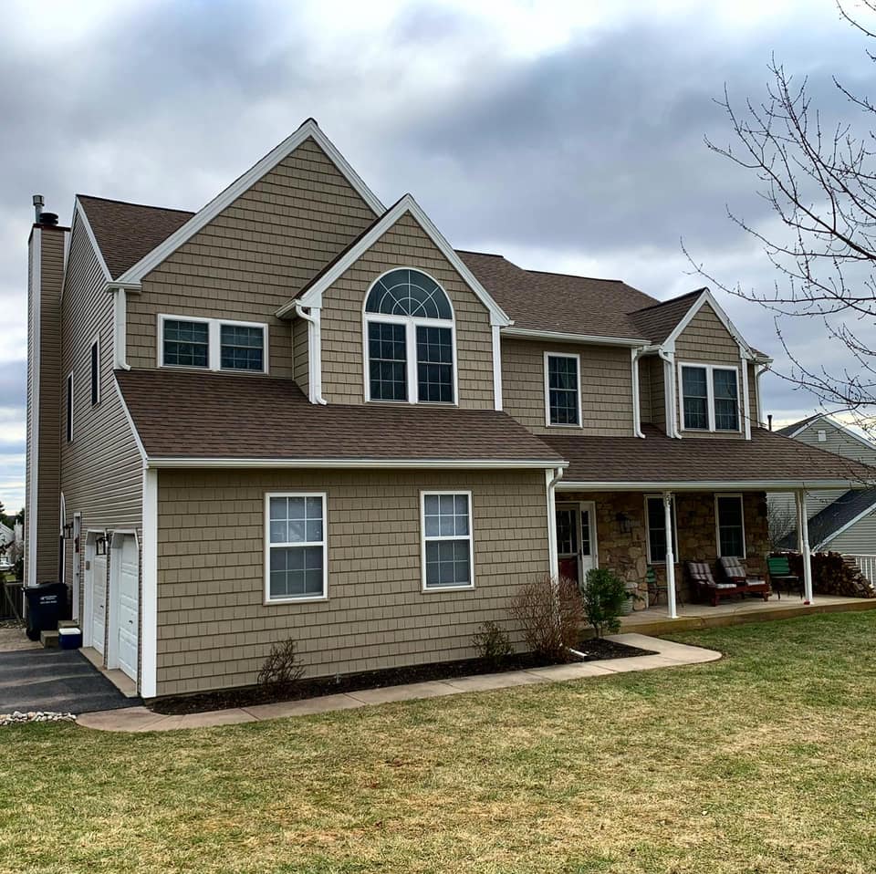 Shot of home with new textured siding, Cedar impressions and Dutchlap